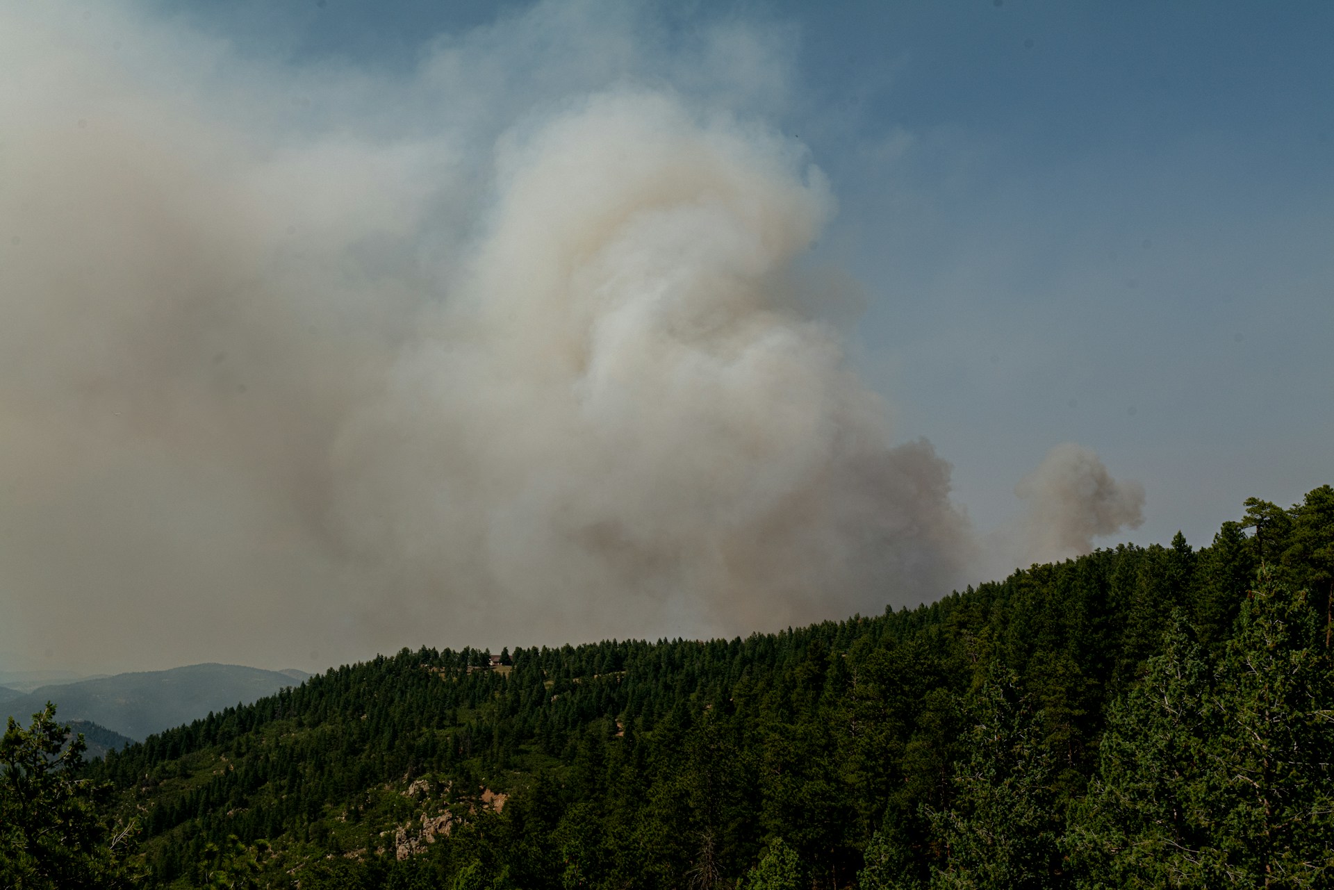 A large plume of smoke in the distance