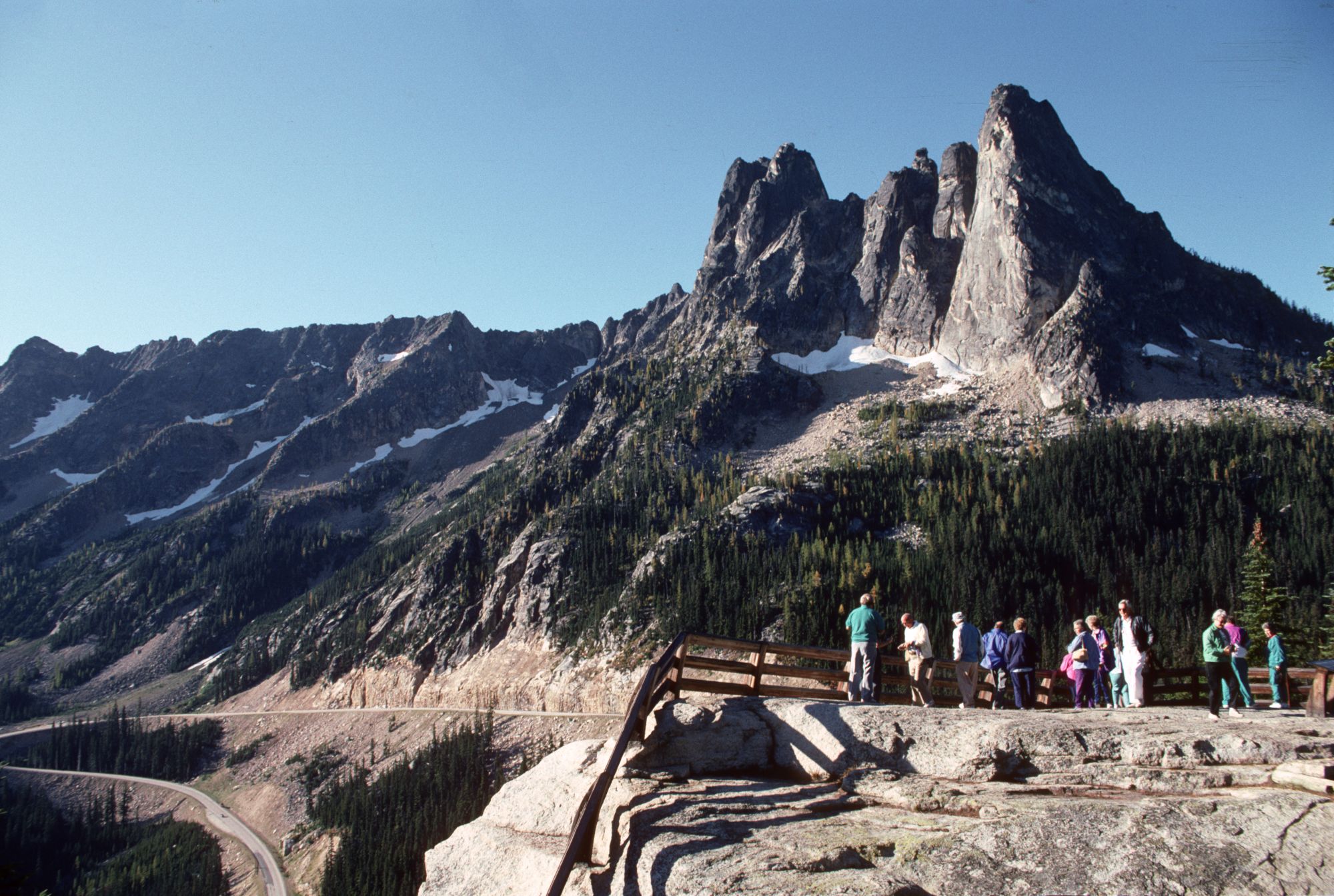Visitors walking the paved overlook path at Washington Pass Overlook